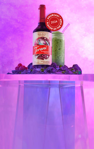 Torani Galaxy Puremade Syrup - Flavor of the year 2024 with matcha drink and galaxy theme background